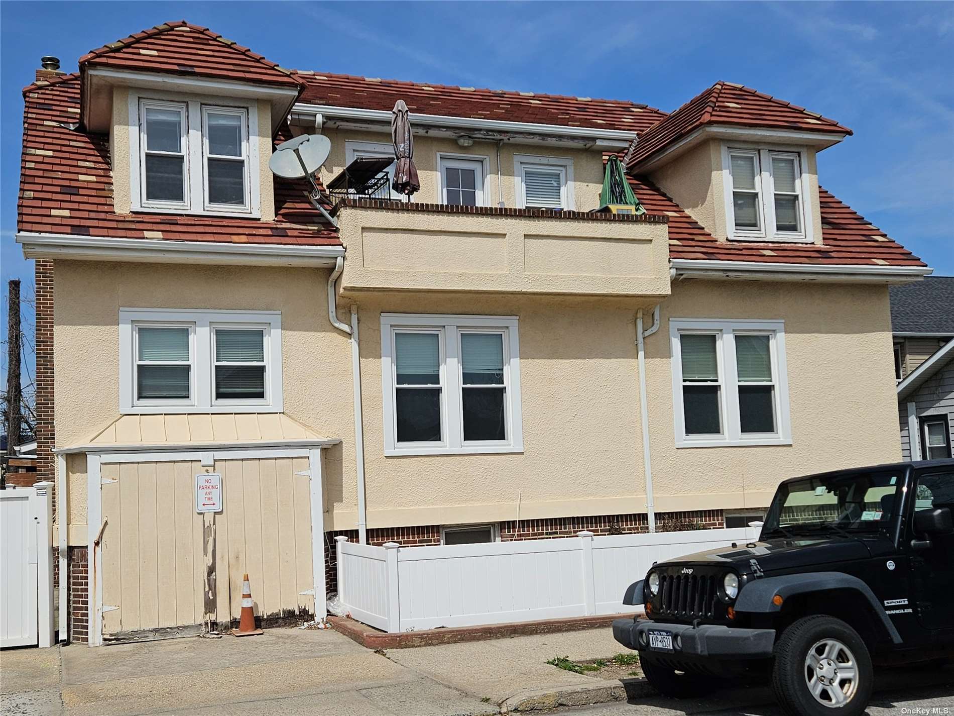 a front view of a house with parking space