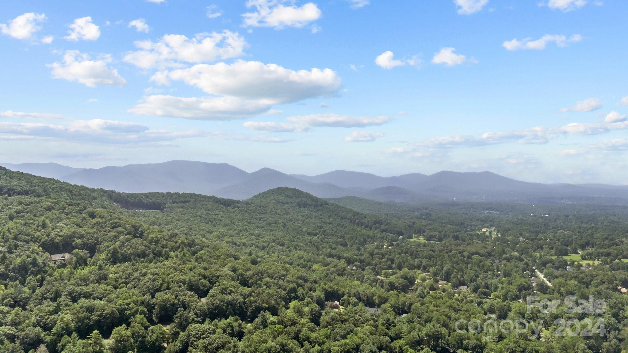 a view of mountains and valleys