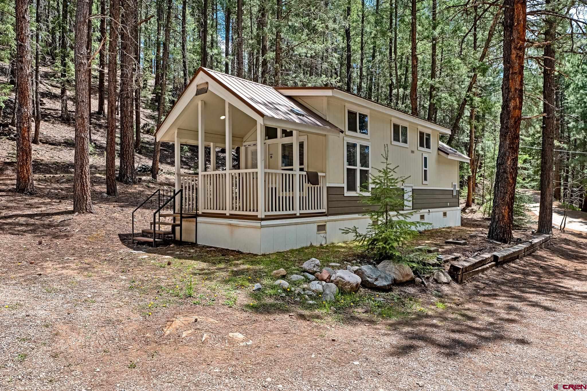 a house with trees in the background