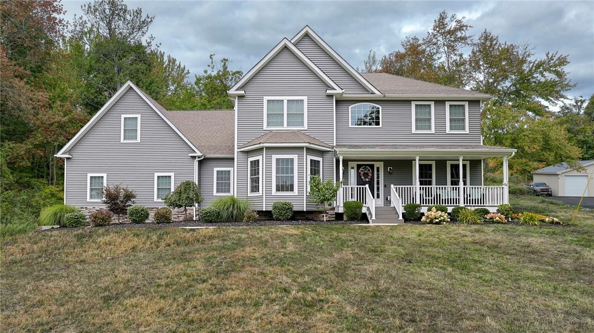 a front view of a house with garden