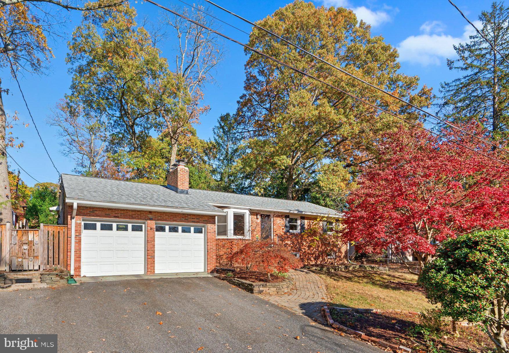 front view of a house with a tree