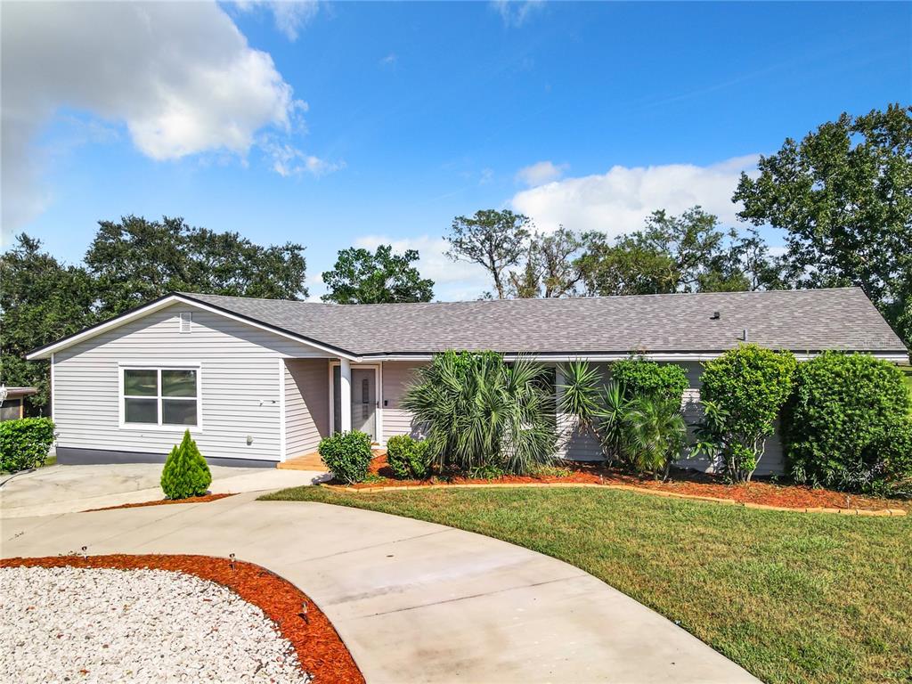 front view of a house with a yard