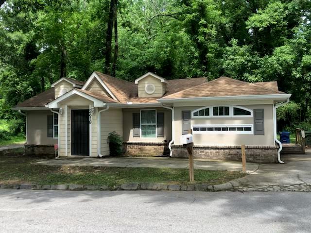 a front view of a house with a yard