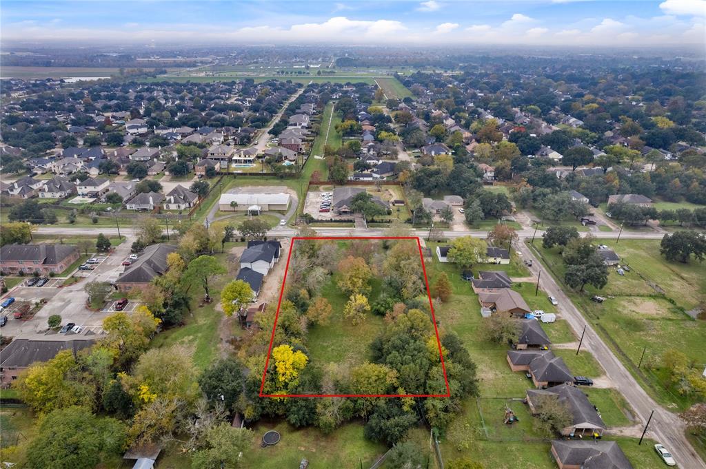 an aerial view of residential houses with city view