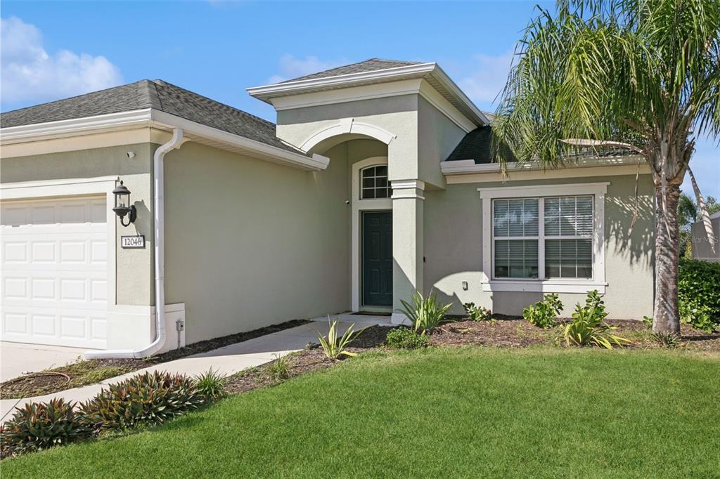 a front view of a house with garden