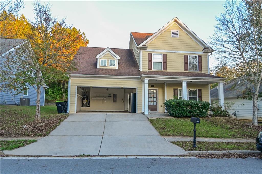 a front view of a house with a garden