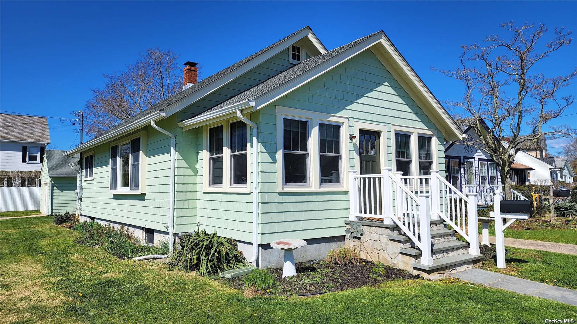 a view of backyard with a garden and deck