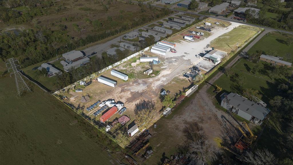 an aerial view of a residential houses with outdoor space