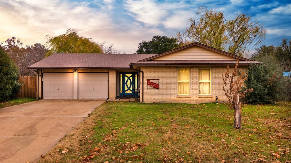 a house with yard in front of it