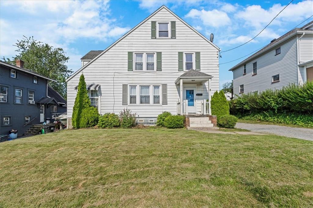 a front view of a house with a yard