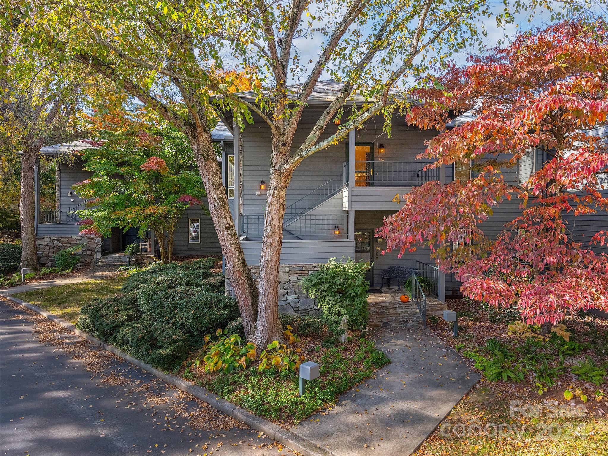 a view of a house with a tree