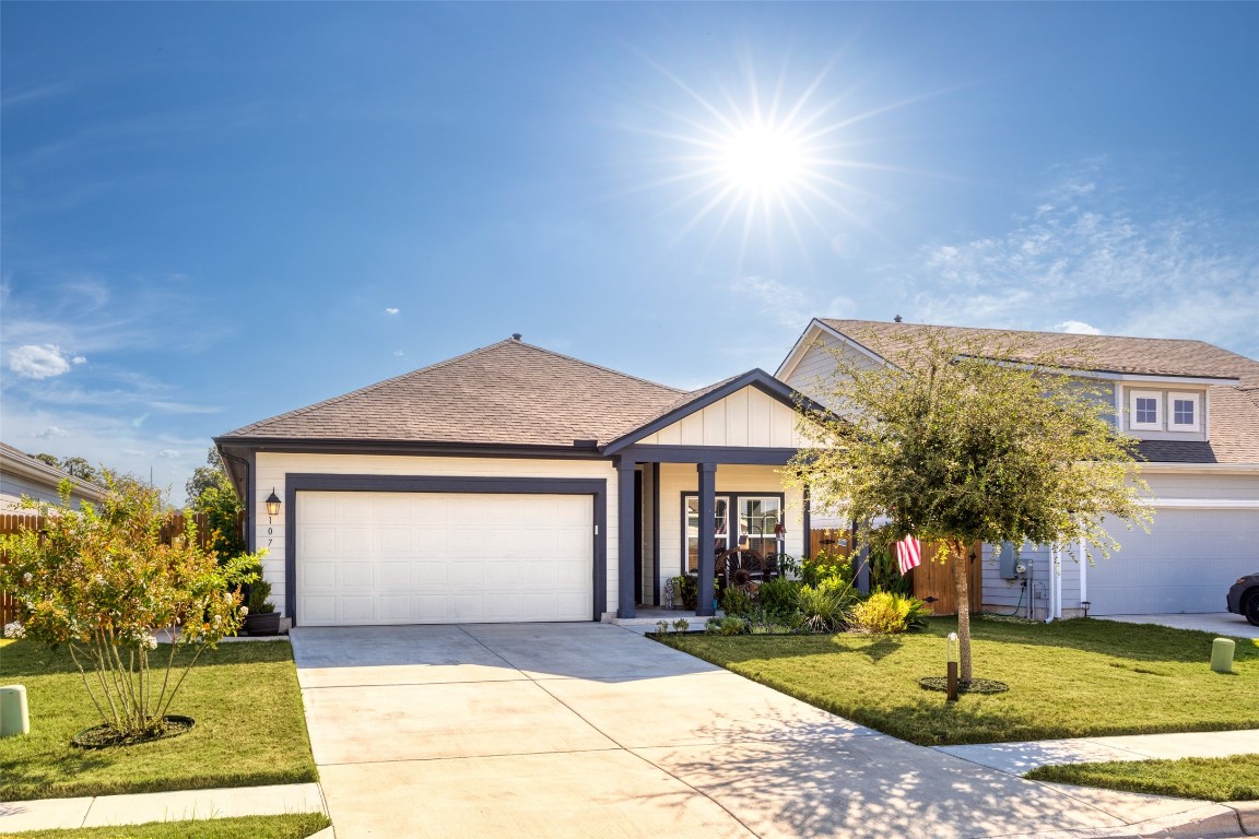 a front view of a house with garden