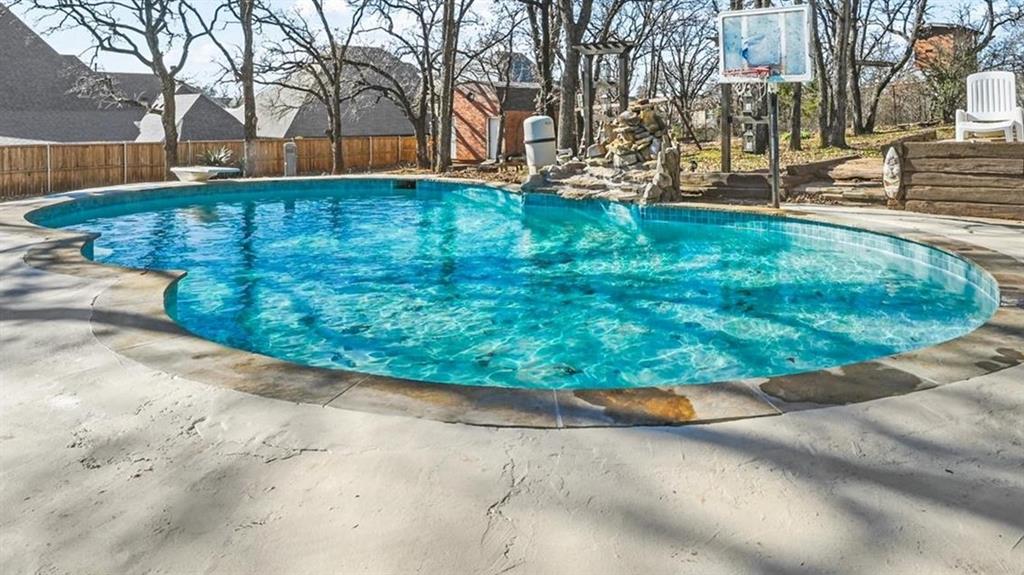 a view of yard with swimming pool