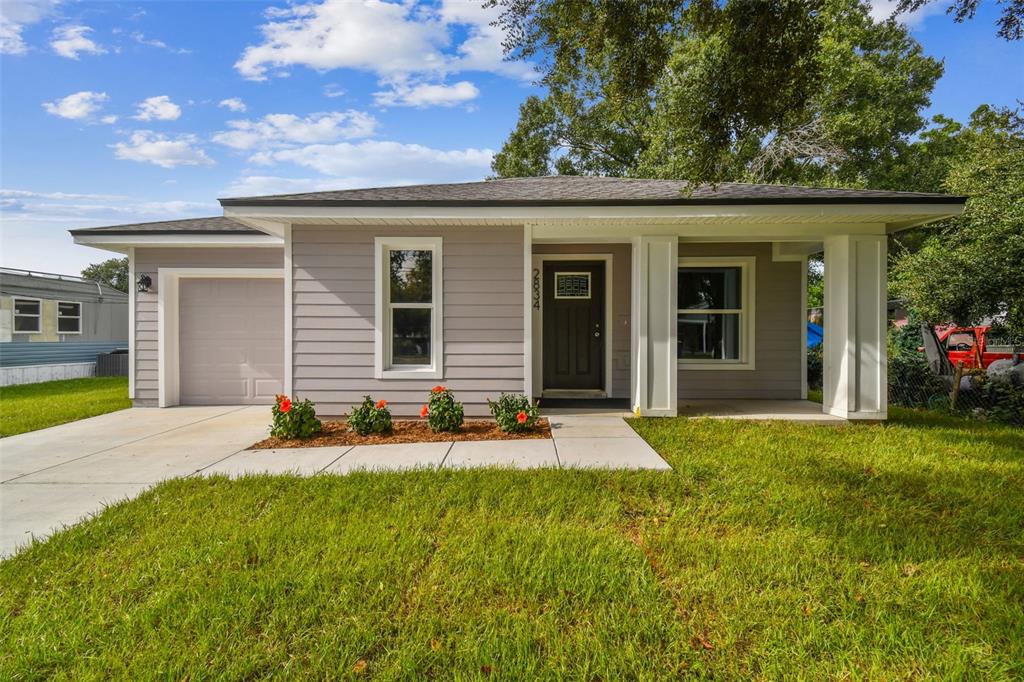 front view of a house with a yard