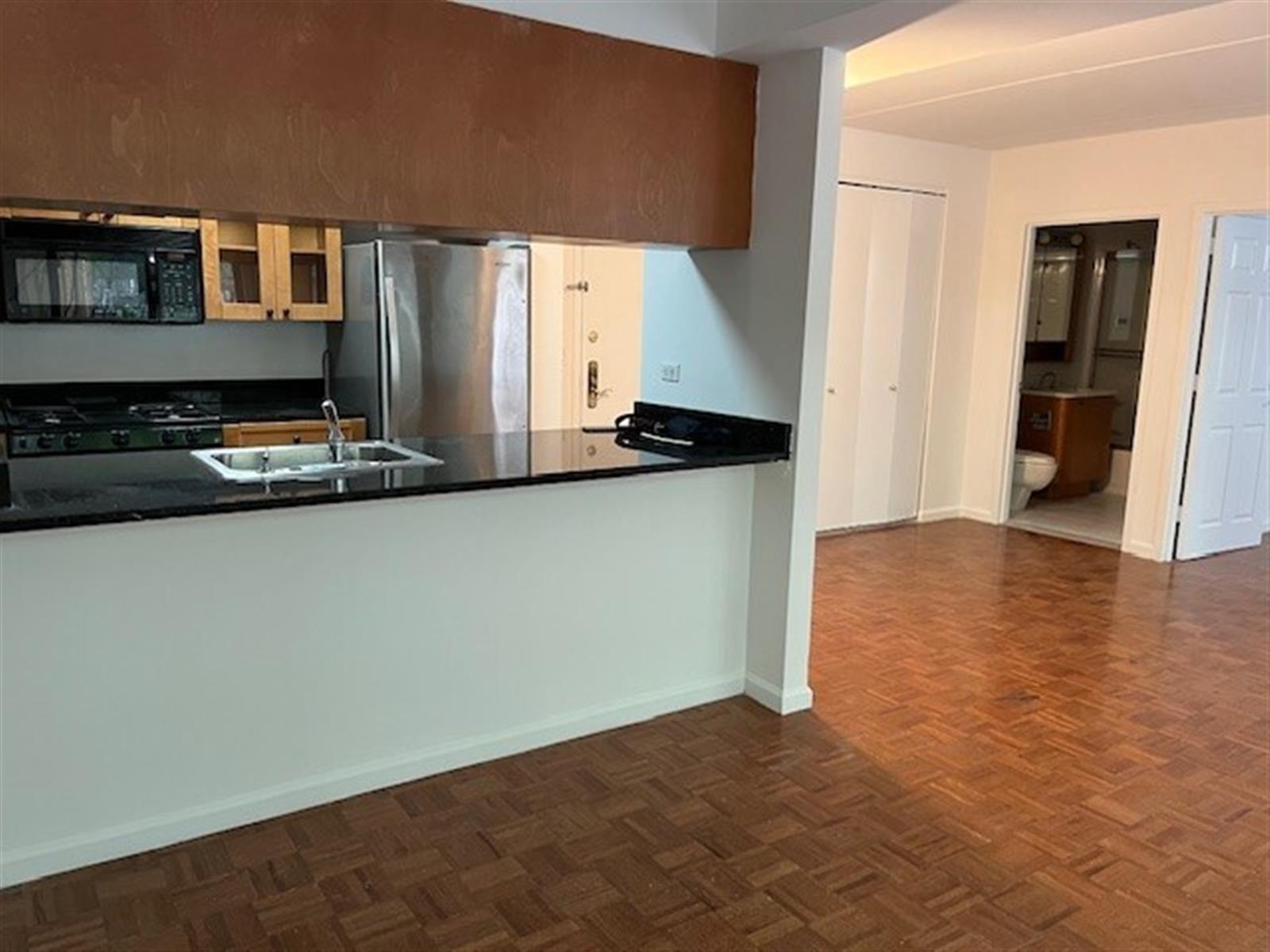 a view of a kitchen with a sink