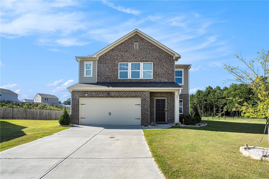 a front view of a house with a yard