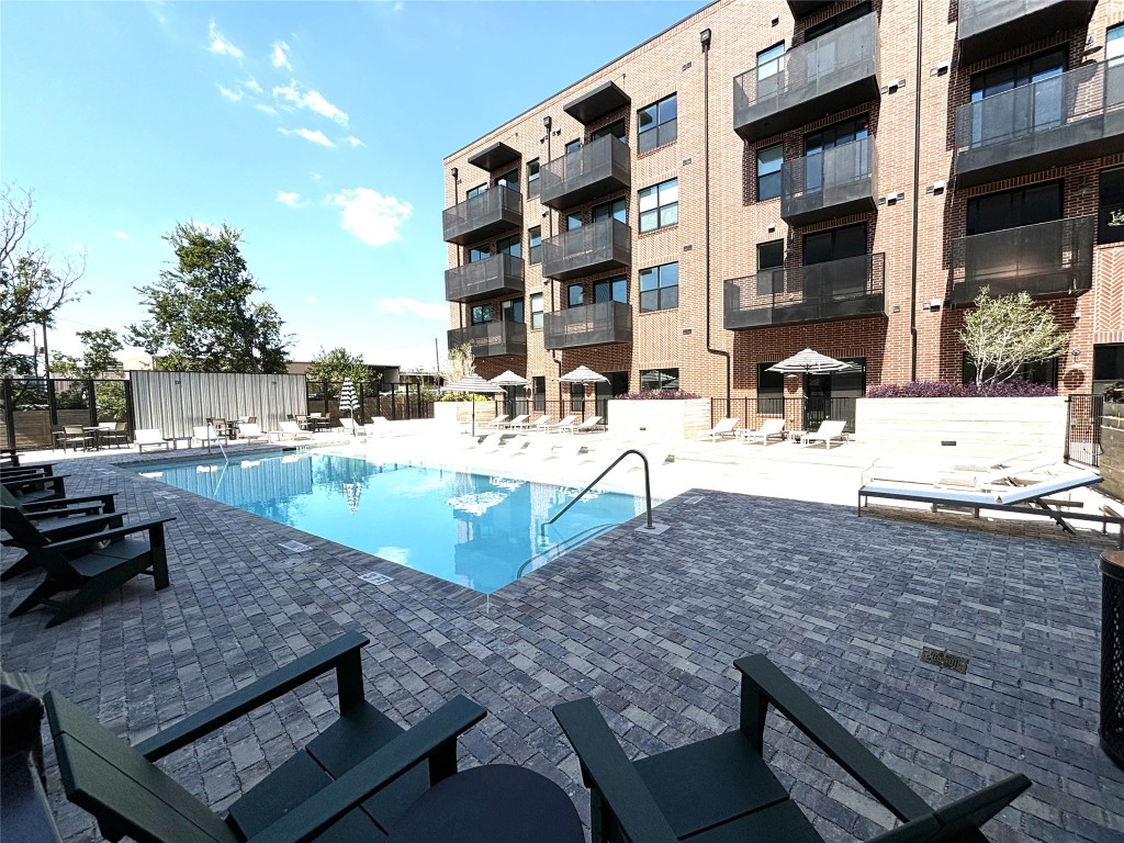 a view of backyard with outdoor seating