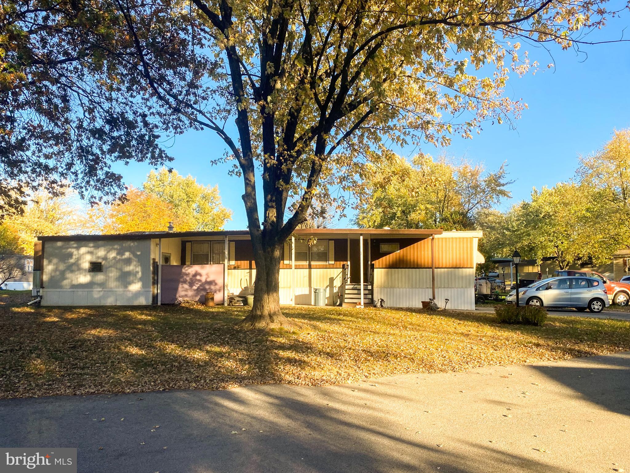 a view of a car park in front of a house