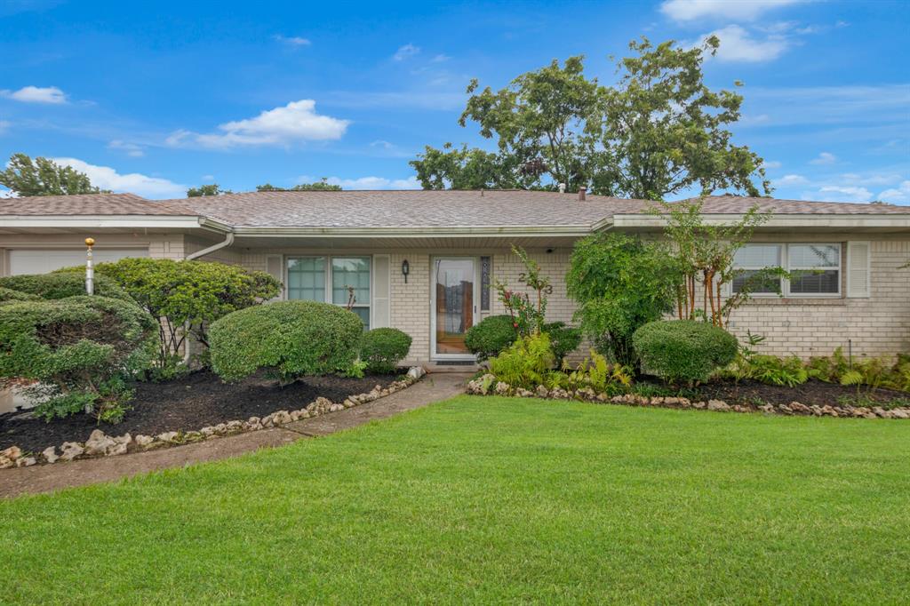 a view of a house with a garden