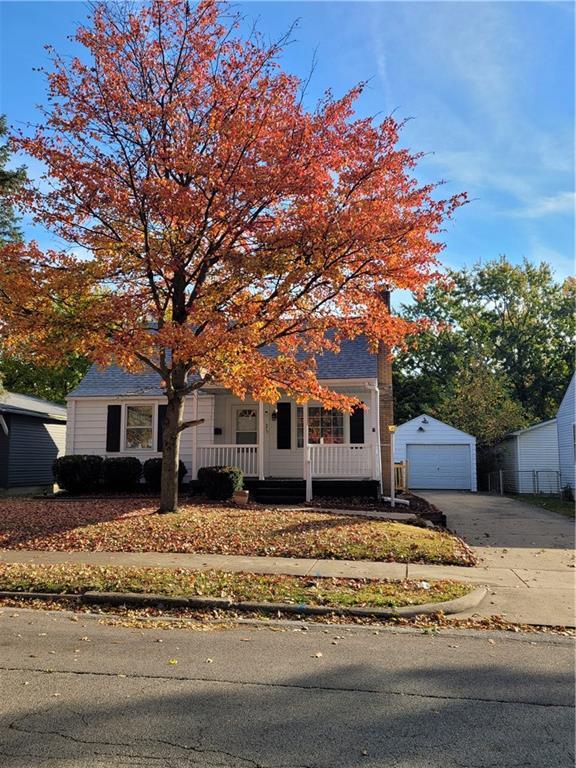 a house that has a tree in front of it