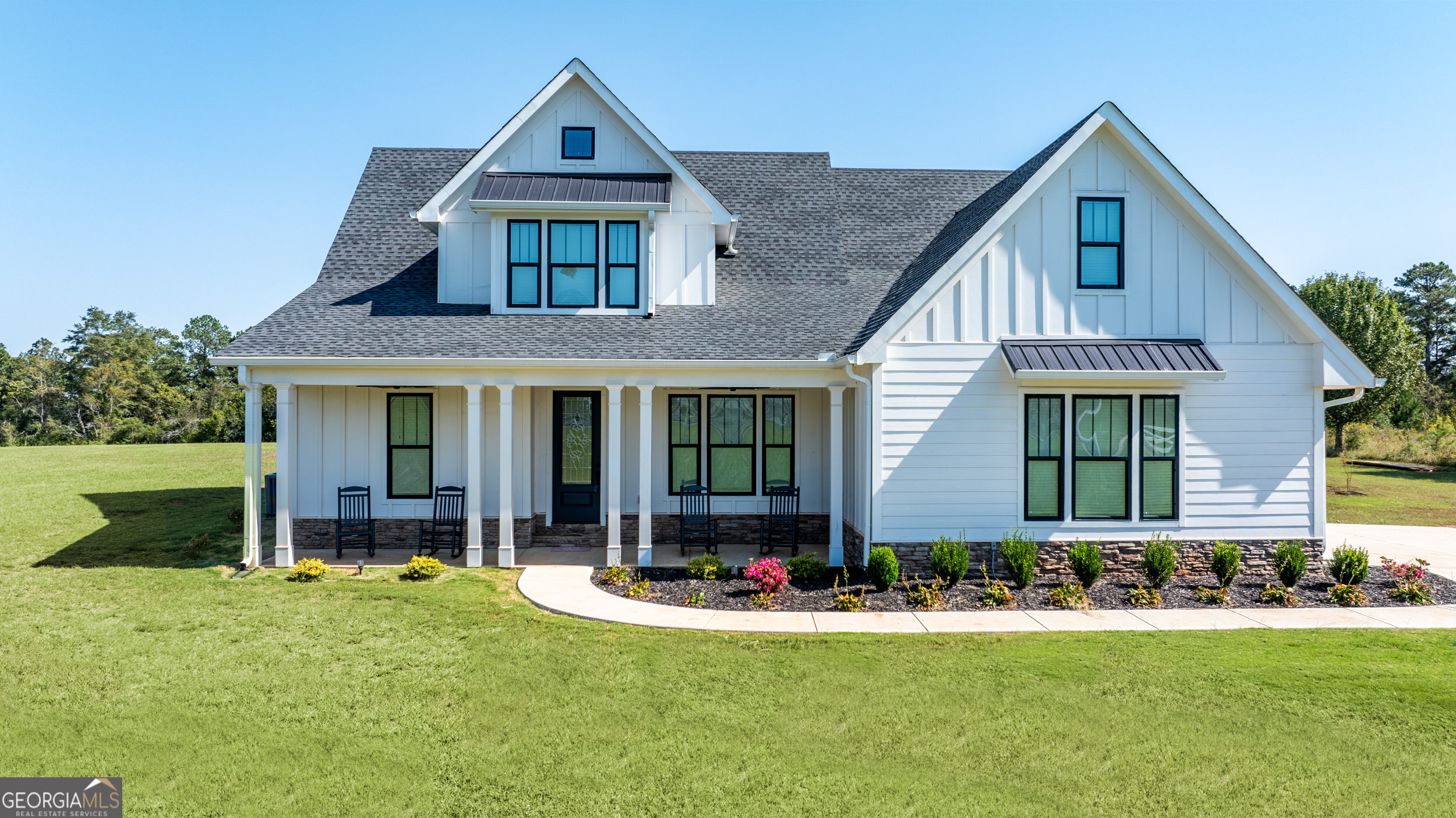 front view of a house with a yard