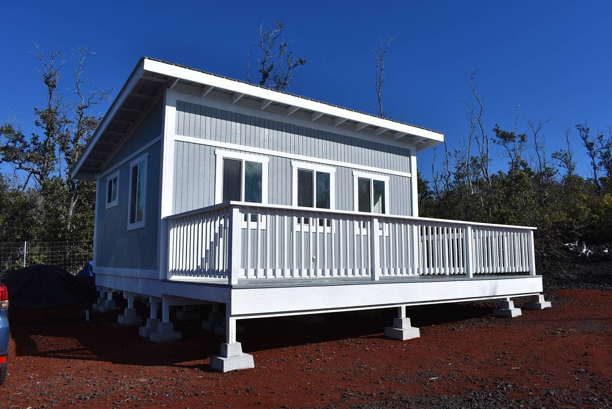 a view of a house with a small yard