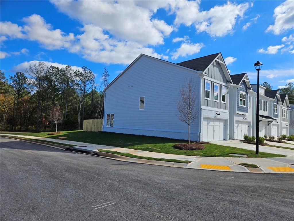 a view of a house with basketball court