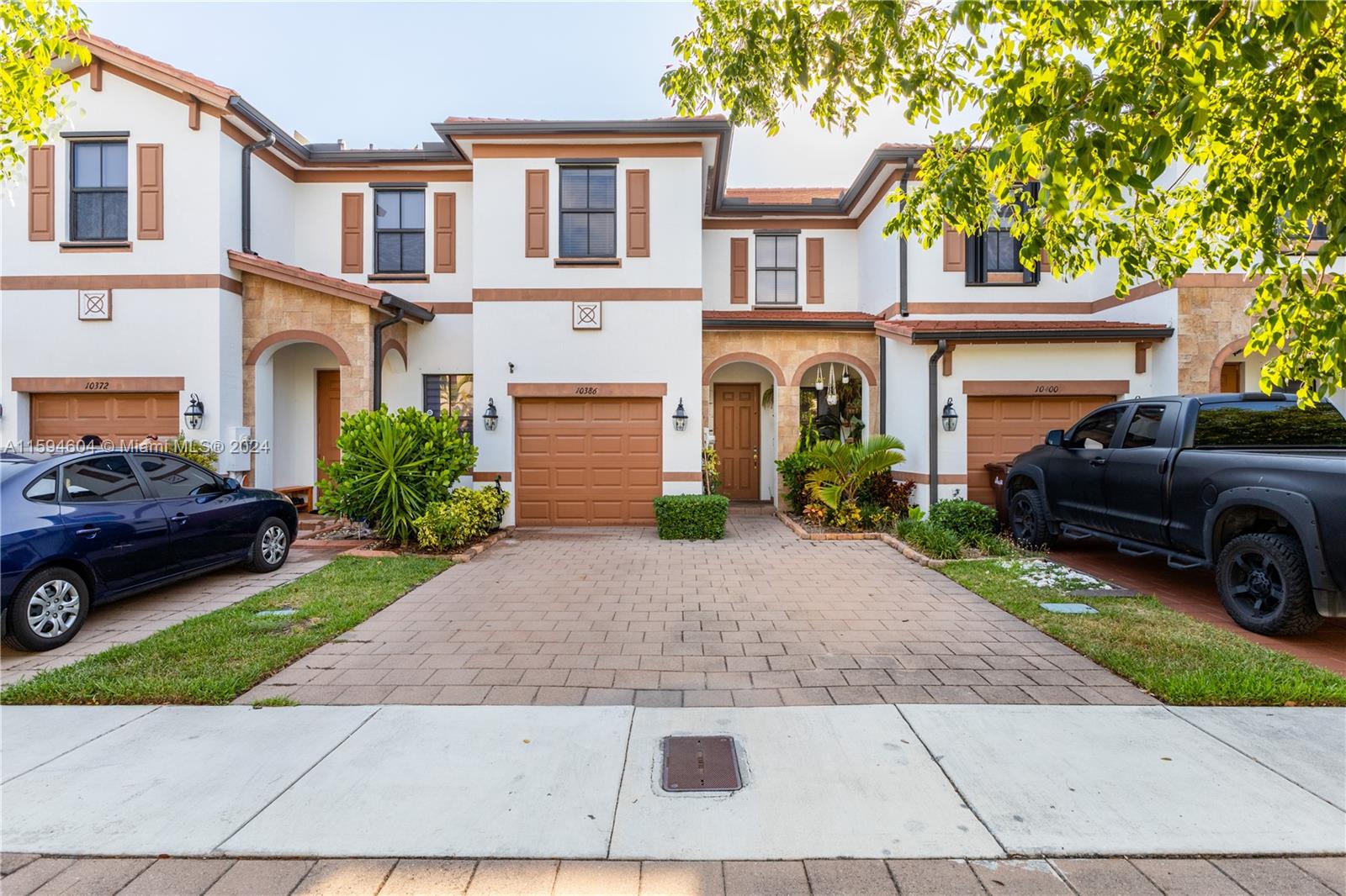 a view of a car parked in front of a brick house