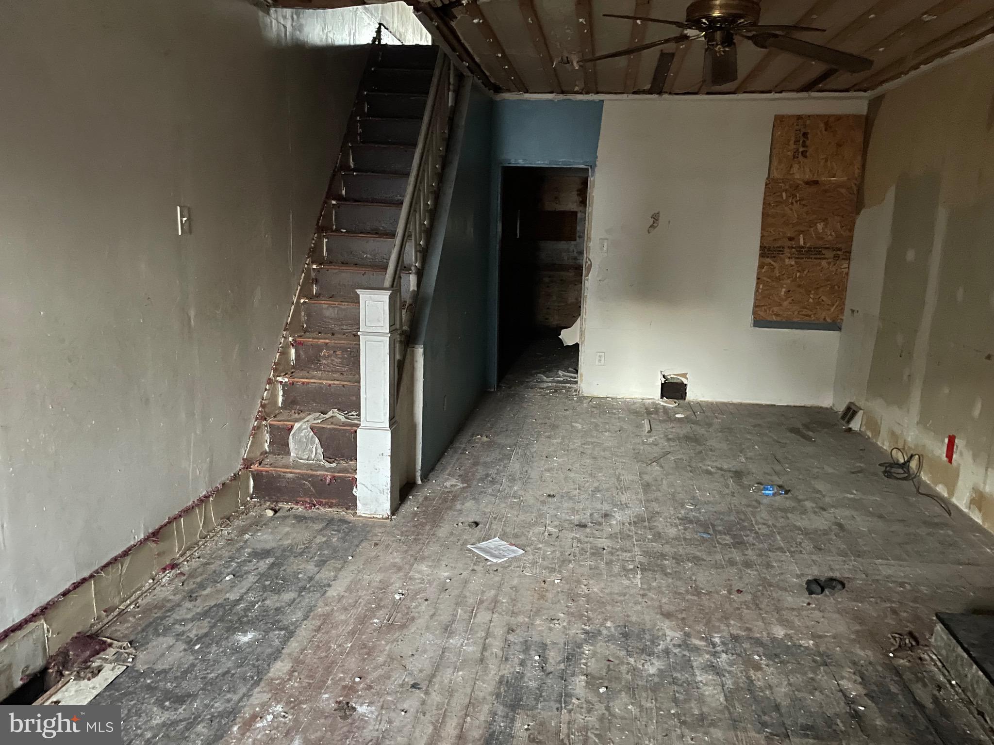 a view of a livingroom with stairs