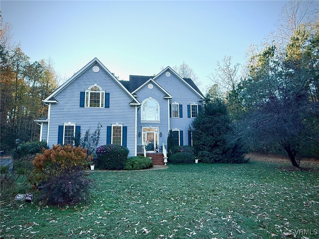 View of front of home with a front lawn