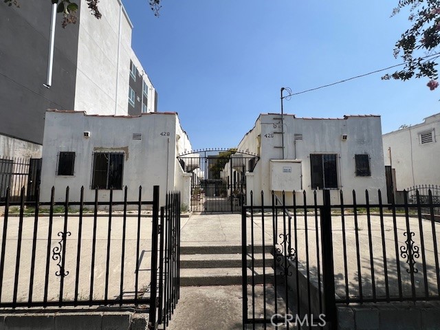 a view of a house with a small yard