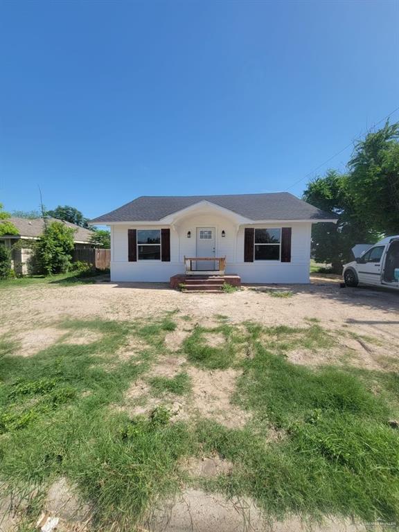 a view of a house with a big yard