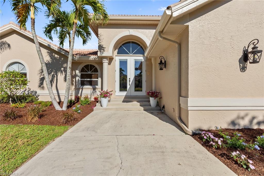 Property entrance featuring french doors