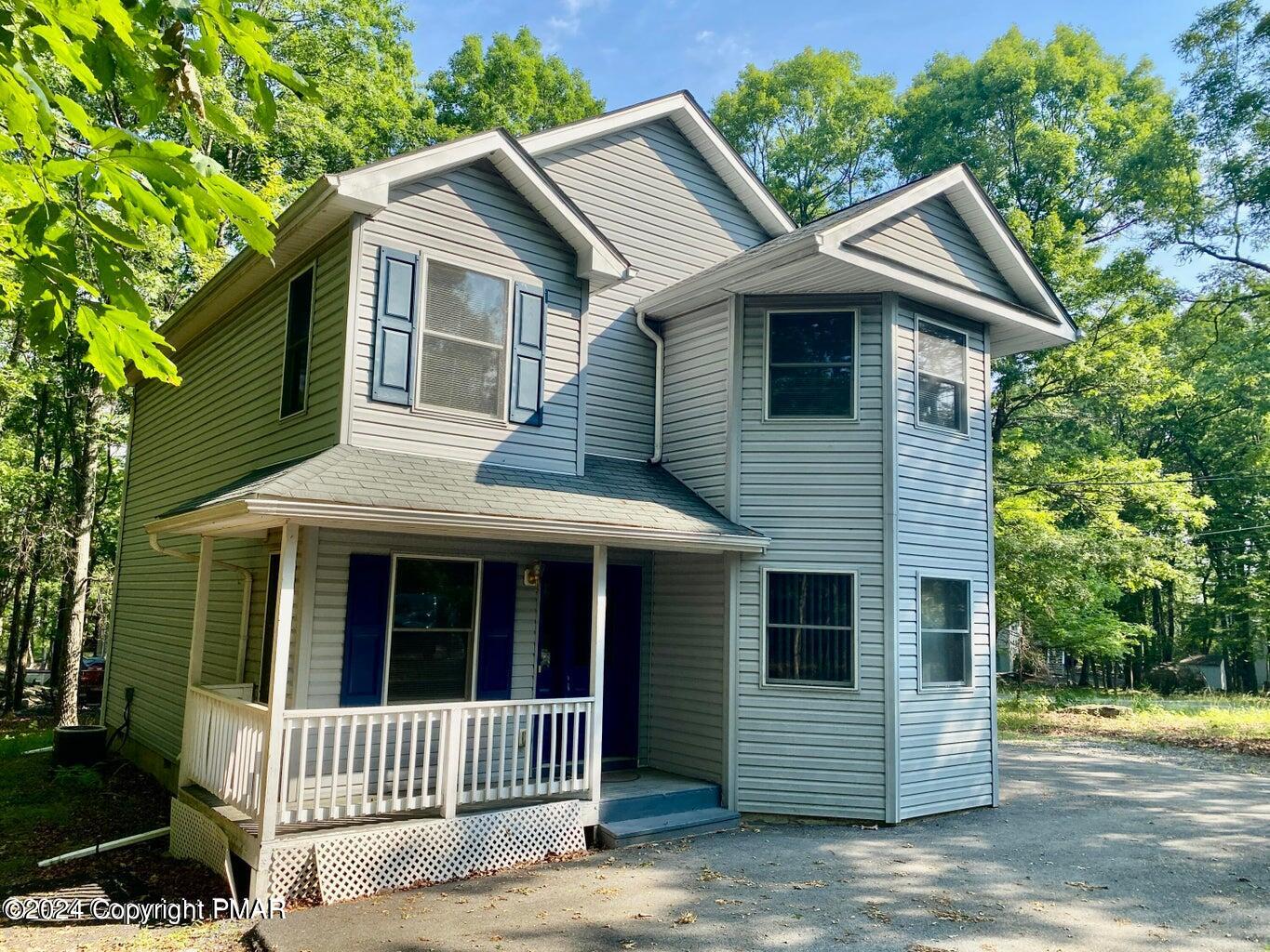 a front view of a house with a porch