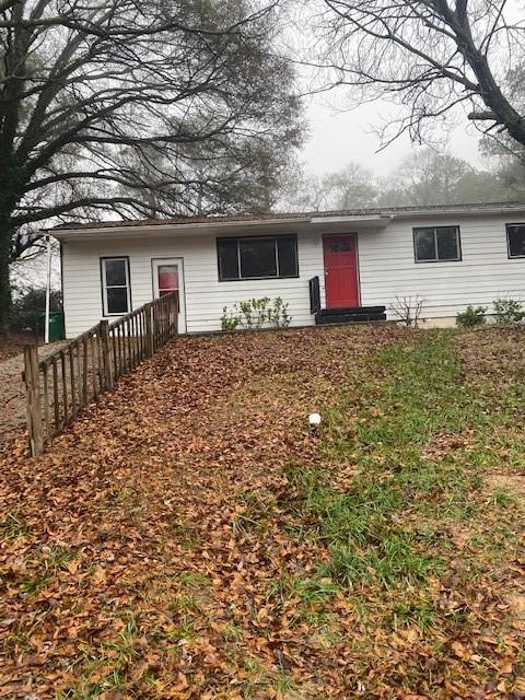 front view of a house with a yard