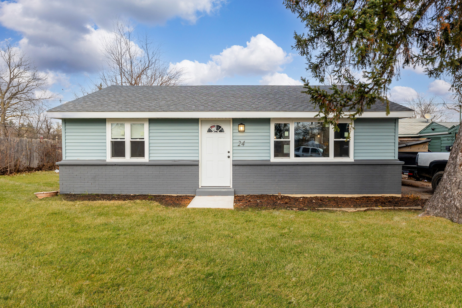 front view of a house with a yard