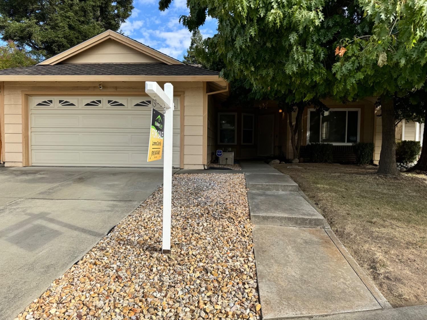 a front view of a house with a garage