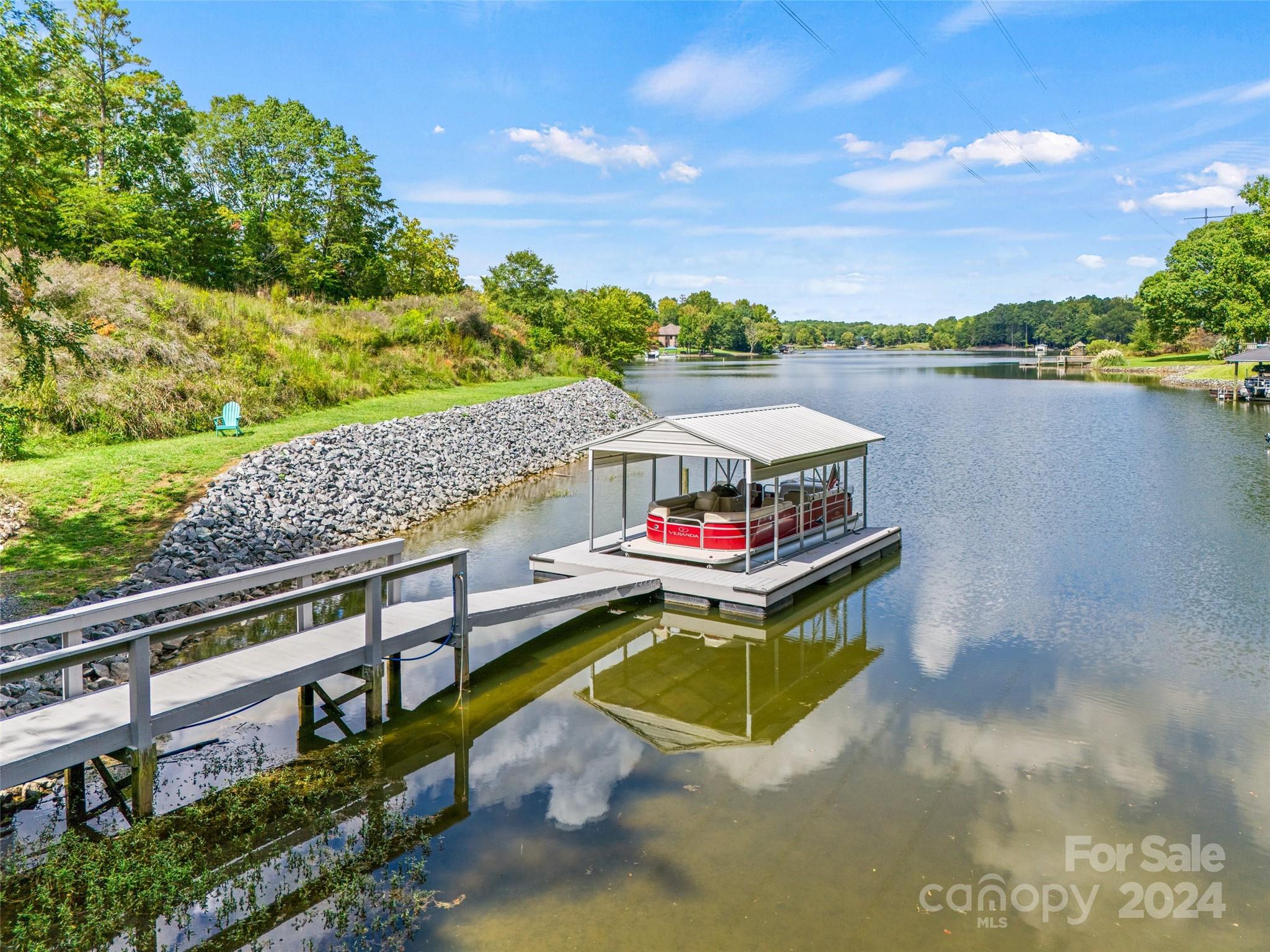 a swimming pool with outdoor seating and yard