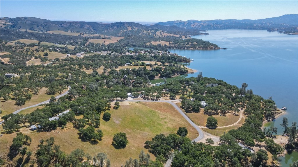 an aerial view of a house with a lake view