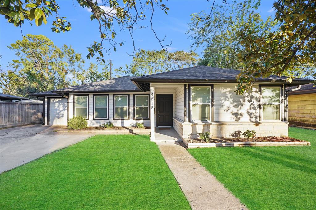 a view of a house with backyard sitting area and garden