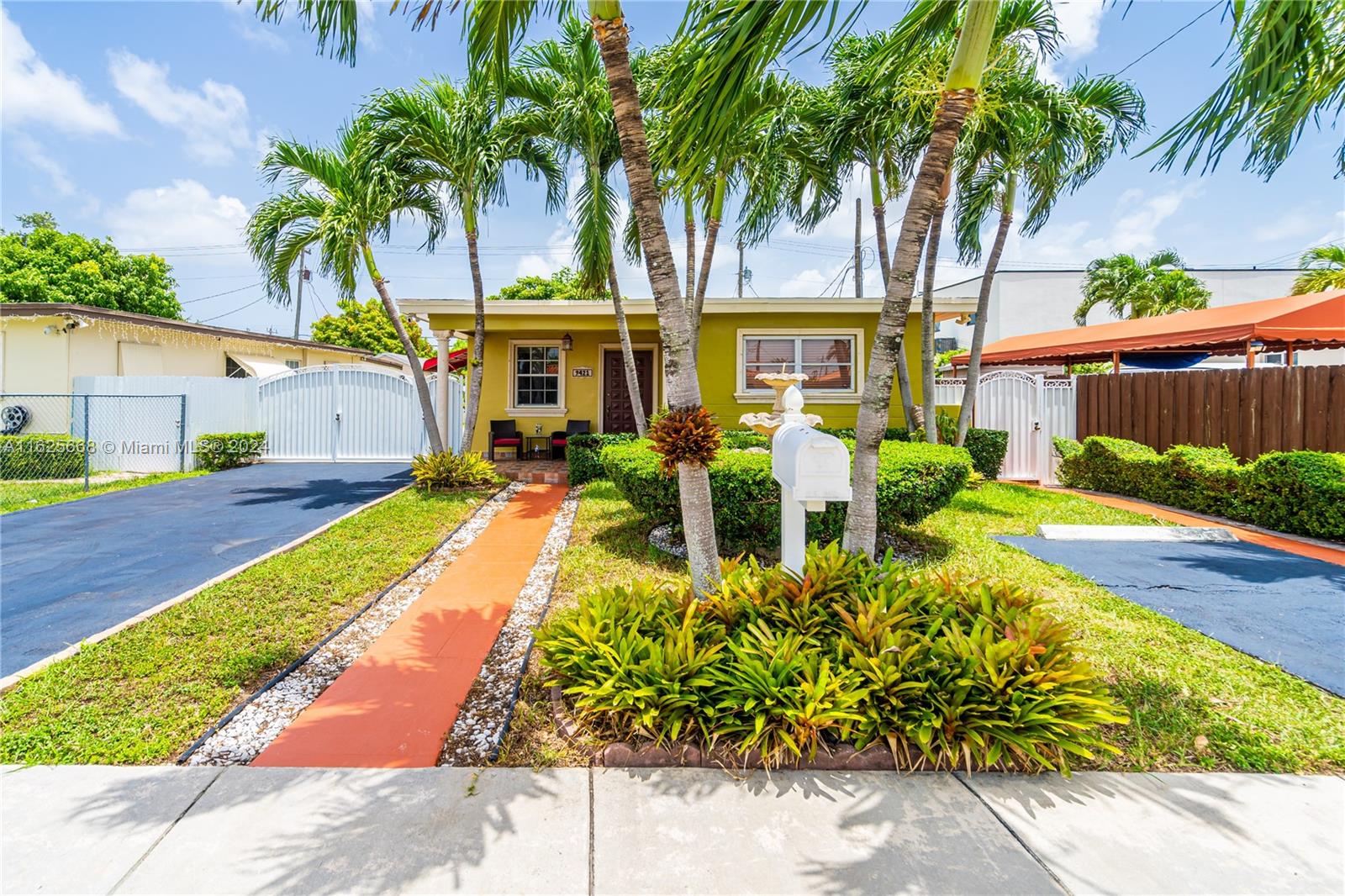 a front view of a house with garden