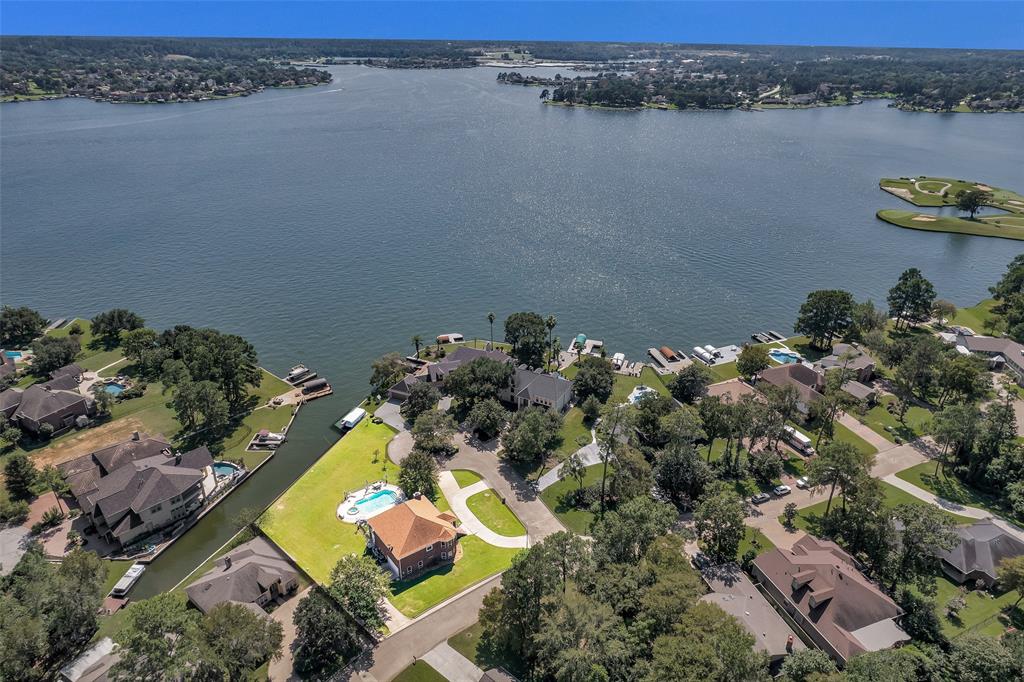 an aerial view of a house with a lake view