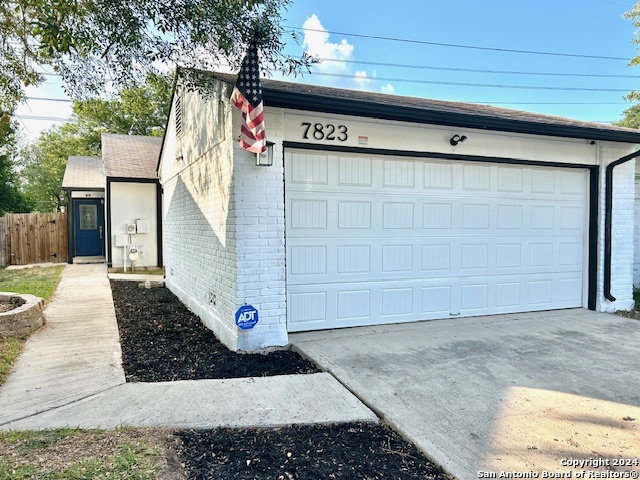 a front view of a house with garage