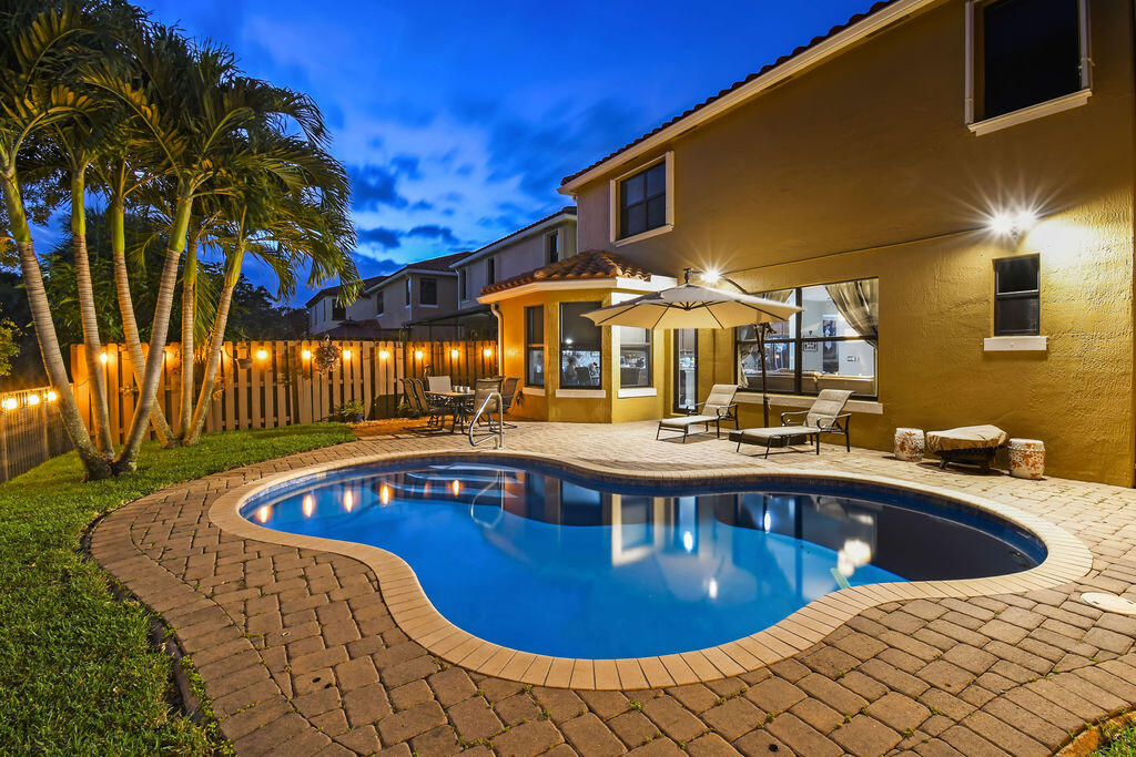 a view of a swimming pool with a patio