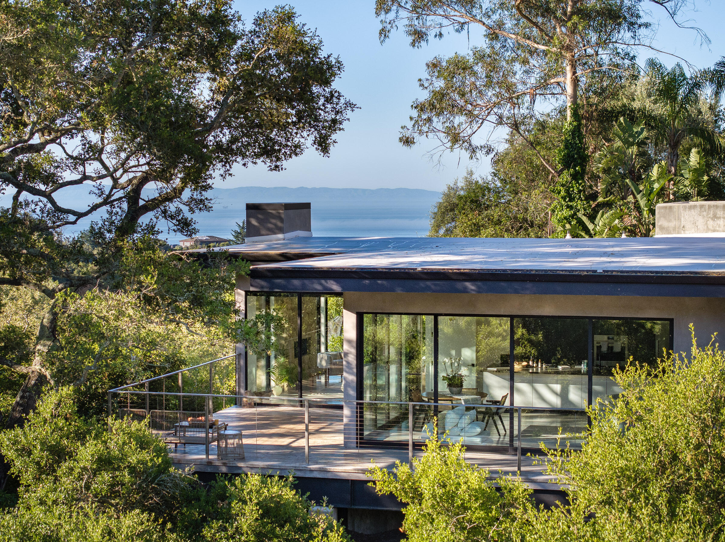 a backyard of a house with outdoor seating