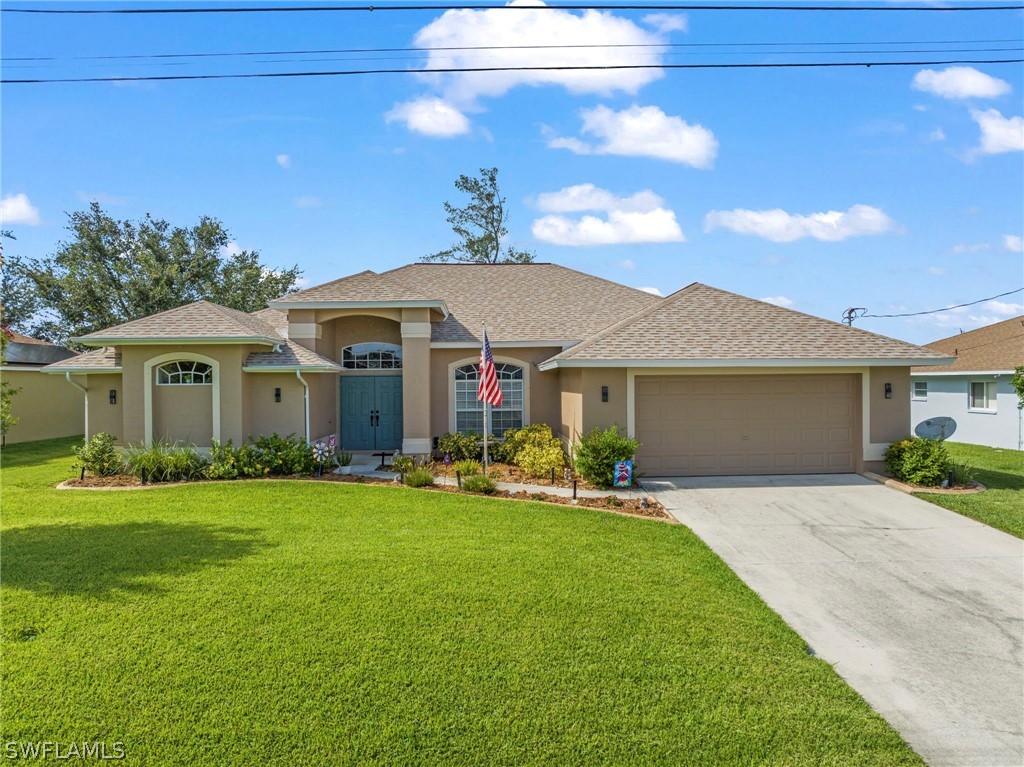 a front view of a house with a yard