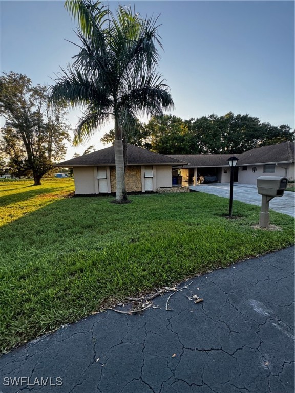 a view of a house with a yard