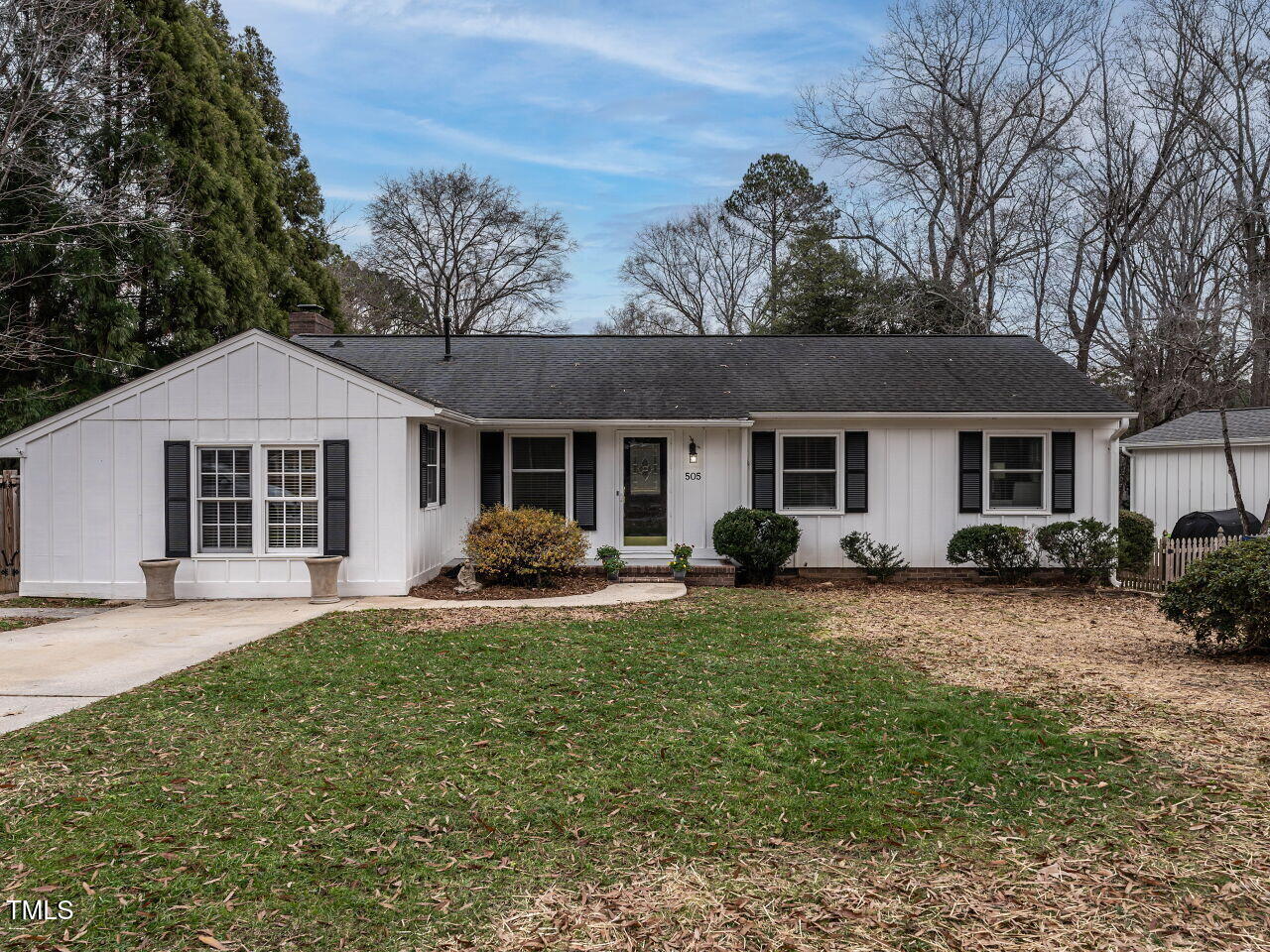 a front view of a house with a yard and porch