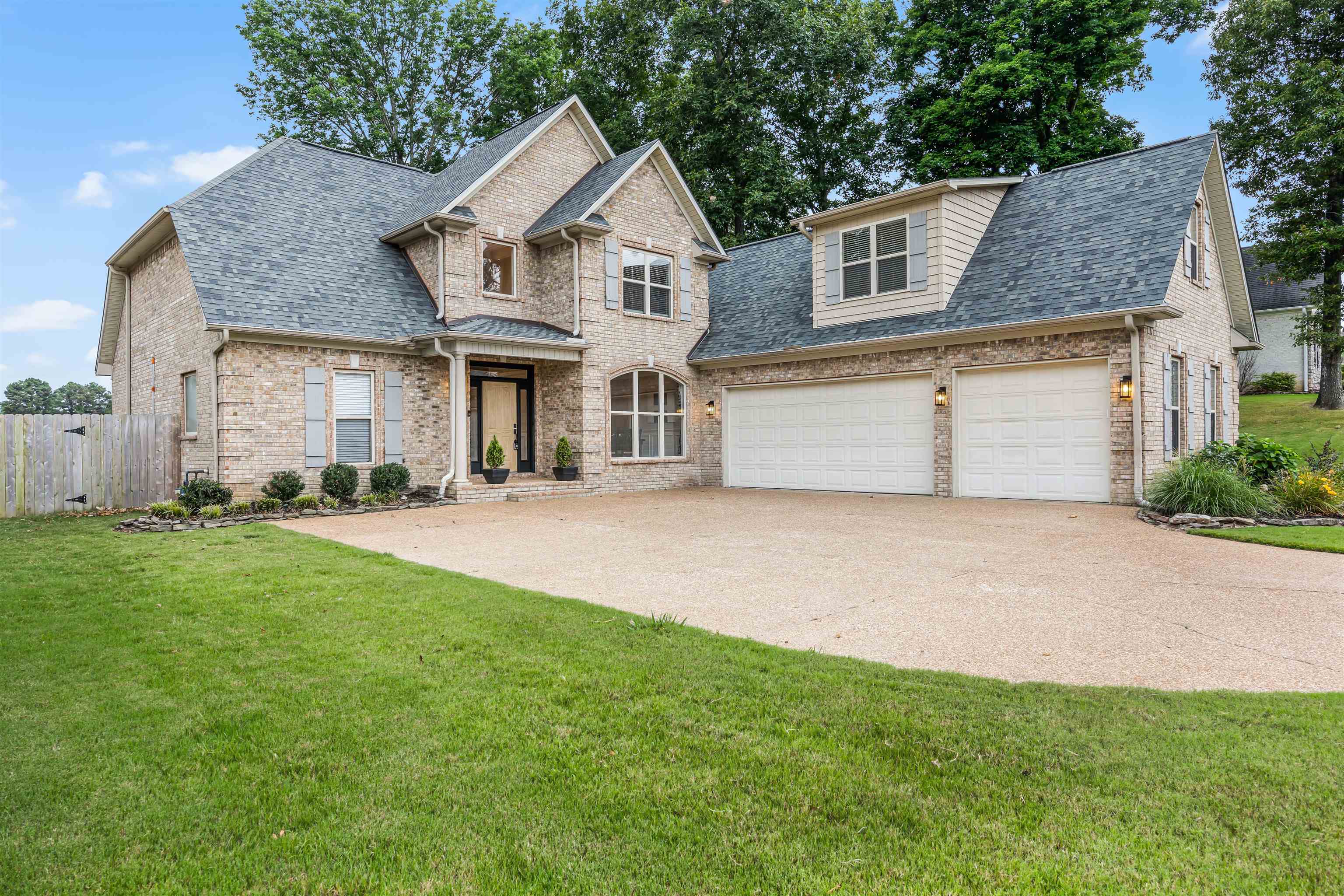 front view of a house with a yard