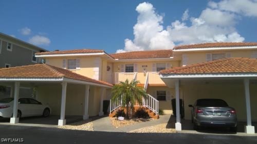 a view of a car park in front of house